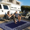 GENIMO Outdoor Rug Waterproof 6’x9′ for Patio, Foldable Reversible Plastic Straw Carpet for Travel Trailers, Outside Area Mat for Rv, Deck, Picnic, Porch, Camper, Balcony, Beach, Purple & Grey(Navy Blue & White | Natural)