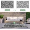GENIMO Outdoor Rug for Patio Clearance, 5’x8′ Reversible Plastic Straw Rugs, Lightweight Waterproof RV Camping Mat for Camper, Balcony, Deck, Backyard, Picnic, BlackBrown(Black&white)
