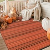 GENIMO Outdoor Rug for Patio Clearance, 5’x8′ Reversible Plastic Straw Rugs, Lightweight Waterproof RV Camping Mat for Camper, Balcony, Deck, Backyard, Picnic, BlackBrown(Orange & Black-w)